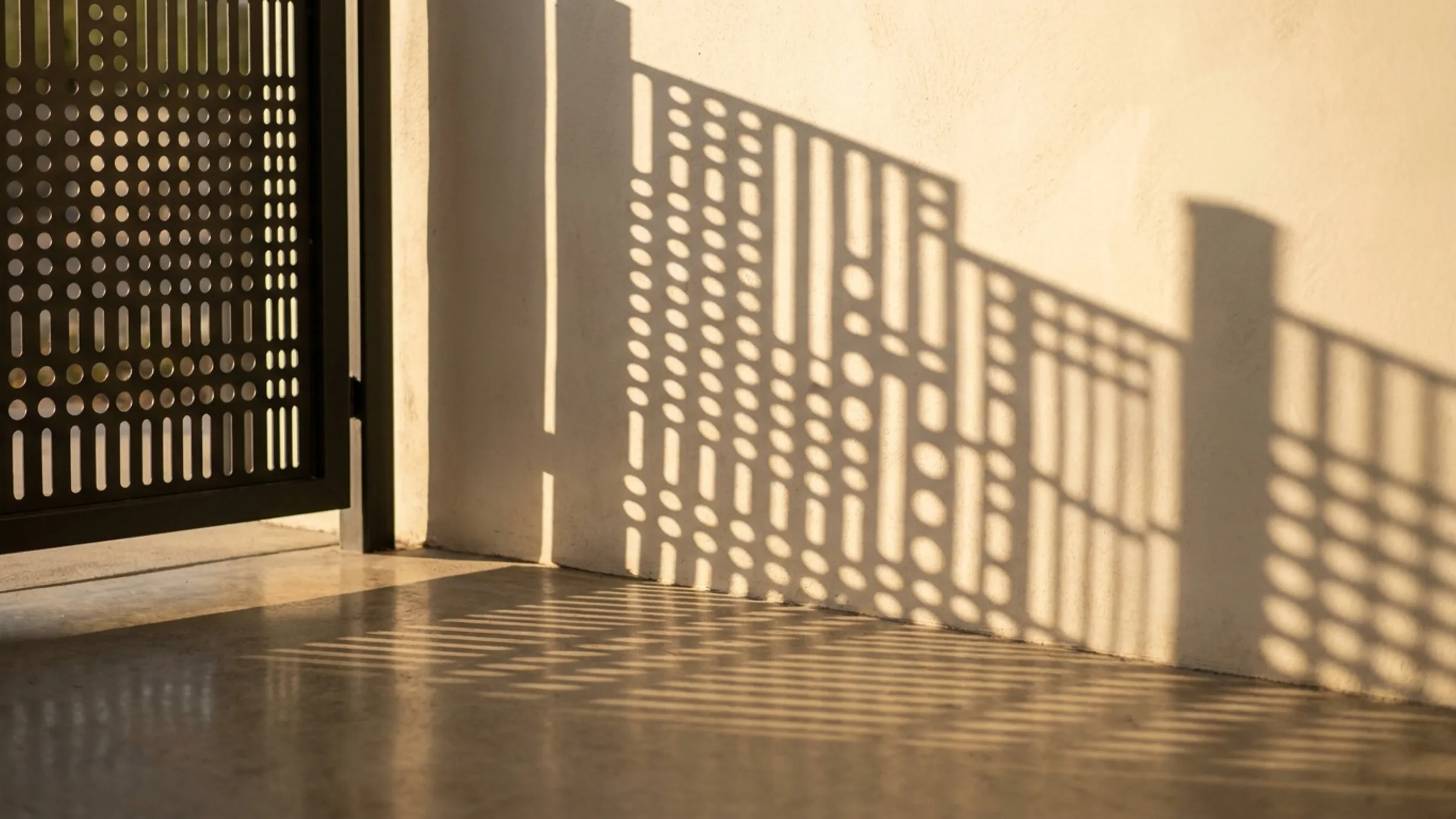 Gates — cast shadow in low sun