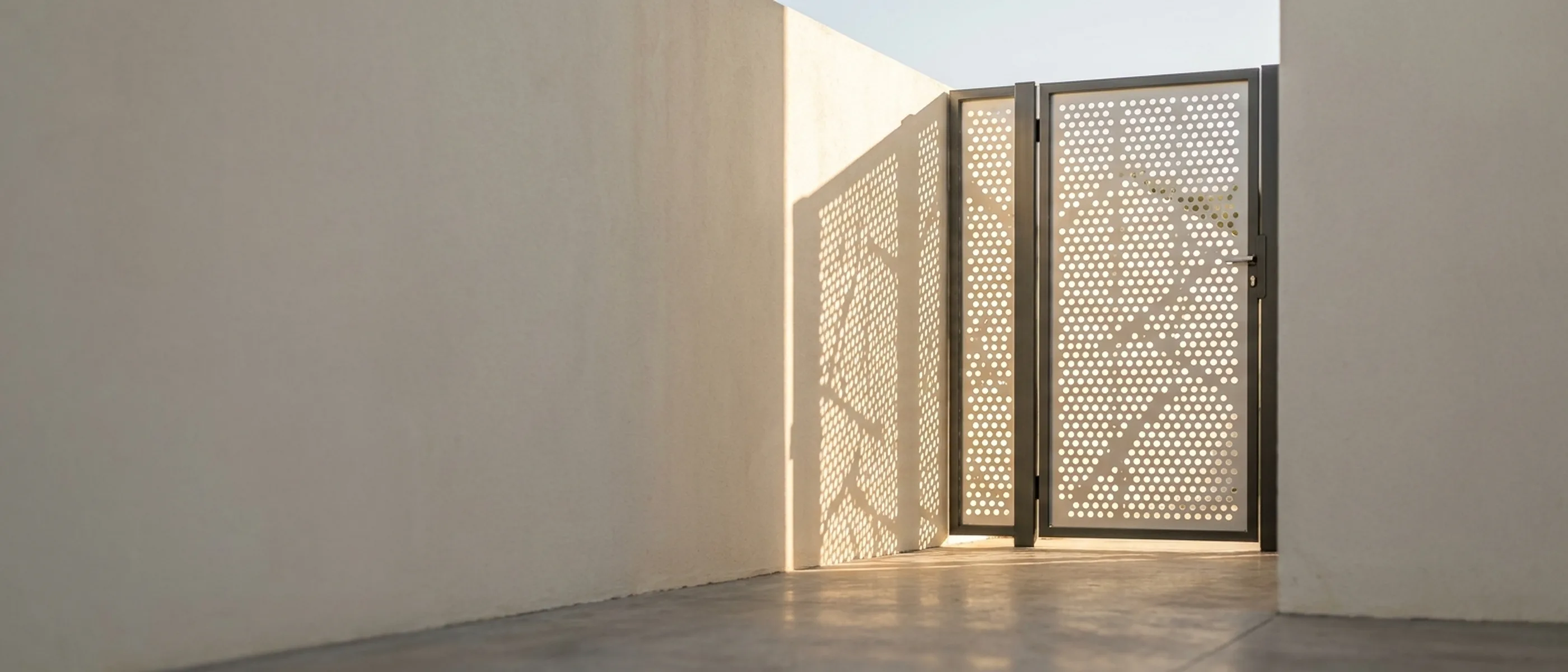 Laser-cut aluminium infill panel fitted into a steel gate frame